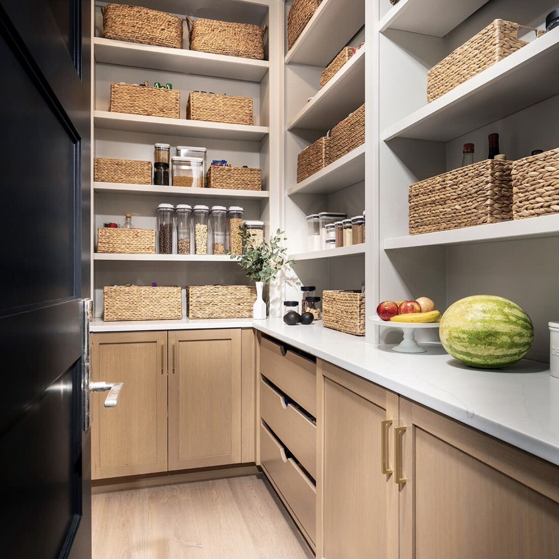 Pantry storage with woven baskets and labeled containers